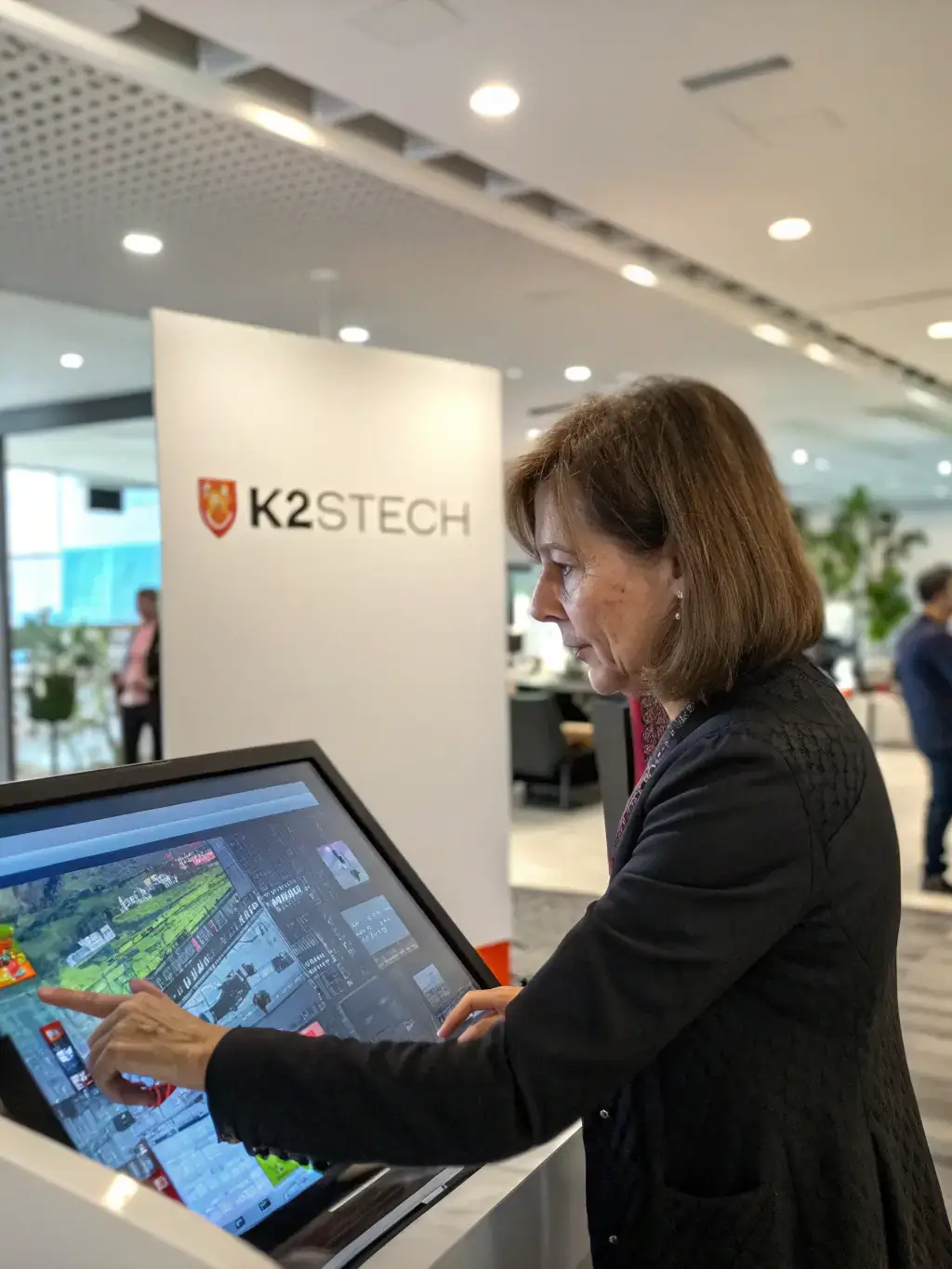 An image of a user interacting with a simulation on a large display, demonstrating the immersive experience and practical applications of the software.